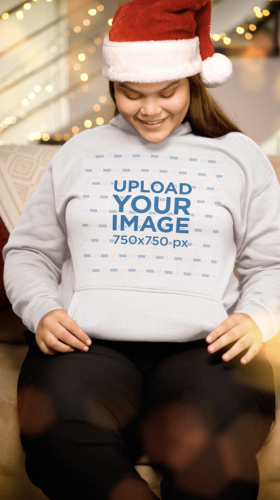 Pullover Hoodie Video Featuring a Happy Woman Wearing Christmas Hat