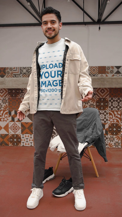 T-Shirt Video Featuring a Happy Man Changing His Clothes With a Jump Transition Effect 6219v