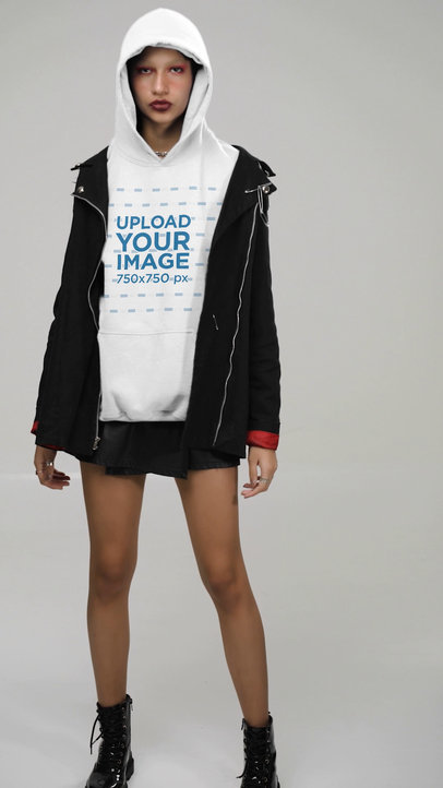 Hoodie Video Featuring a Serious Woman Wearing a Dark Jacket