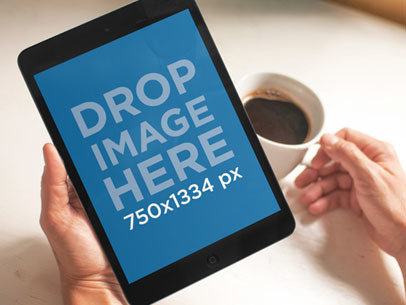 Mockup of a Woman Holding a Mini iPad