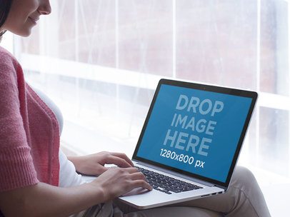 Woman Typing on Her Macbook Pro Mockup Template