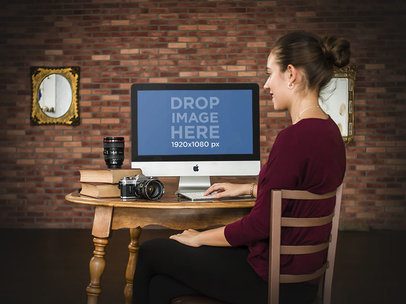 Mockup of a Freelance Female Photographer Working on Her iMac