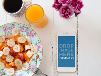iPhone 6 Sitting Next to a Fruit Plate Mockup a5544