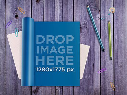 Magazine Mockup Featuring a Magazine Lying on Top of a Wooden Table