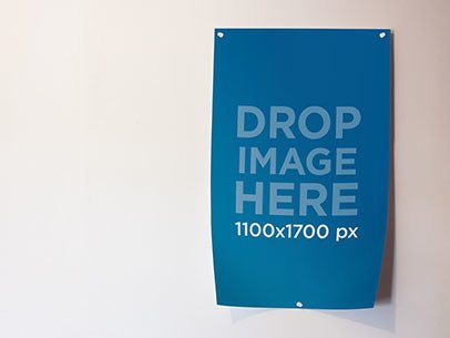 Mockup of a Poster Taped to a White Wall