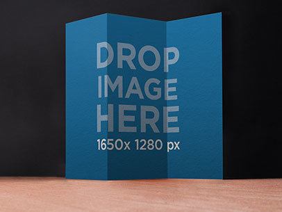 Brochure Mockup Standing Over a Wooden Surface