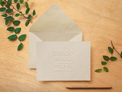 Envelope Mockup Featuring an Open Envelope on Top of a Wooden Desk 