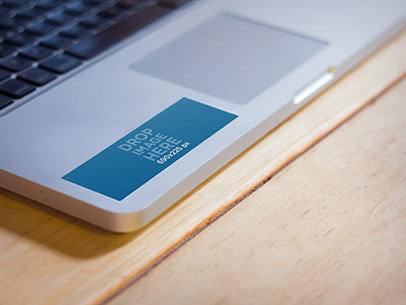 Mockup Featuring a Sticker Pasted to a Macbook Pro