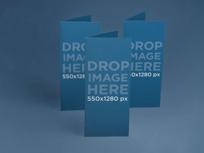 Mockup Featuring a Set of Brochures Standing Over a Flat Background