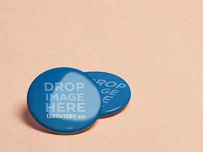 Branding Mockup Featuring Two Pins Over a Colored Background a6369