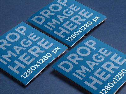 Mockup Featuring 3 Square Brochures Lying Over a Smooth Background