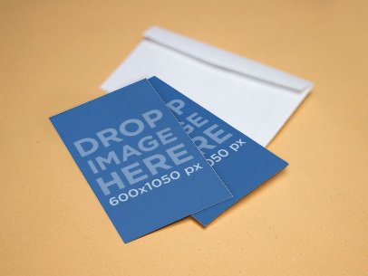 Mockup Featuring Two Business Cards Lying on Top of an Envelope