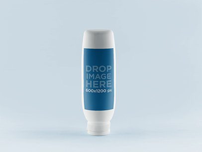 Mockup of a Cream Bottle Standing on a Flat Surface 