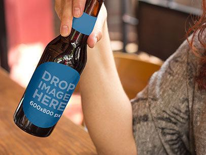Label Mockup of a Woman Having a Beer at a Bar
