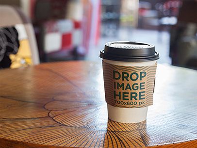 Takeaway Coffee Cup Mockup on Top of a Café Table