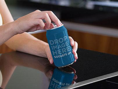 Label Mockup of a Woman Opening a Soda Can