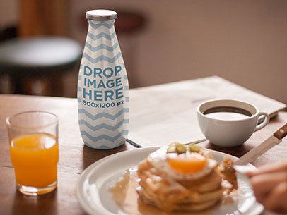 Mockup Featuring a Bottle of Milk at a Breakfast Table 