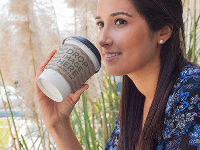 Label Mockup Featuring a Woman Drinking Coffee From a Takeaway Cup