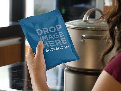 Label Mockup Featuring a Woman Holding a Bag of Dry Soup a7199