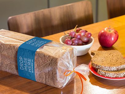Label Mockup of a Packaged Loaf of Bread on Top of a Table a7267