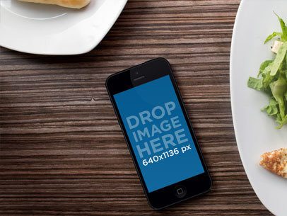 Mockup of an iPhone Placed on a Dining Table