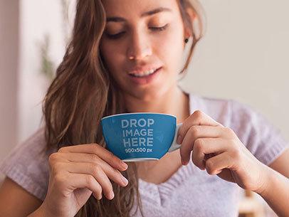Mockup of a Young Woman Having a Cup of Coffee 