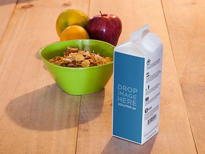 Packaging Mockup of a Milk Carton at a Breakfast Table