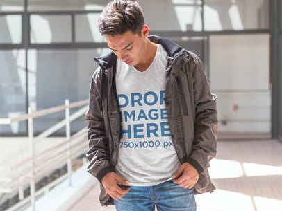 T-Shirt Mockup of a Young Man Walking Around