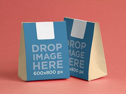 Paper Bag Mockup Featuring Two Paper Bags Over a Flat Surface