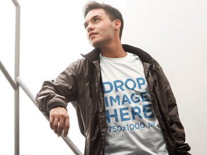T-Shirt Mockup of a Man Walking Down a Flight of Stairs