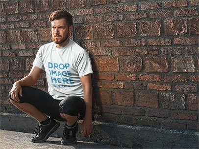T-Shirt Mockup Featuring a Bearded Man in Sportswear