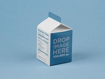 Packaging Mockup Featuring a Juice Box Over a Flat Surface