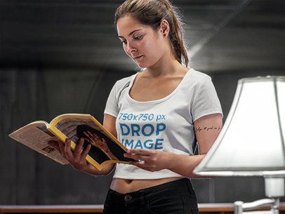T-Shirt Mockup of a Woman Reading a Magazine
