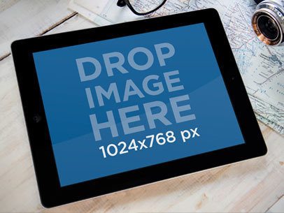 Mockup of an iPad Placed Next to a Map