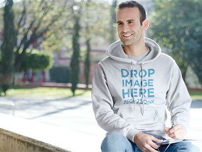 Male Student Sitting on a Bench at School Hoodie Mockup a8710