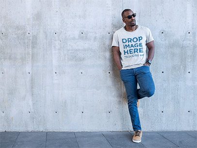 Man Leaning on a Concrete Wall T-Shirt Mockup