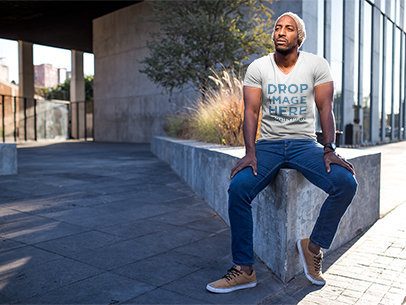 Man Sitting on a Concrete Planter T-Shirt Mockup