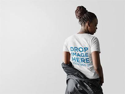 Mockup of a Woman Facing Backwards Wearing a Tee