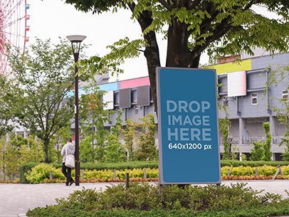 Vertical Banner Mockup at an Amusement Park a10457