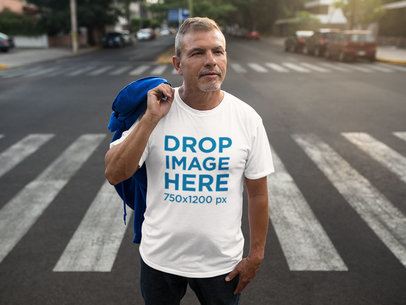 T-Shirt Mockup Featuring a Man Standing in a Crosswalk