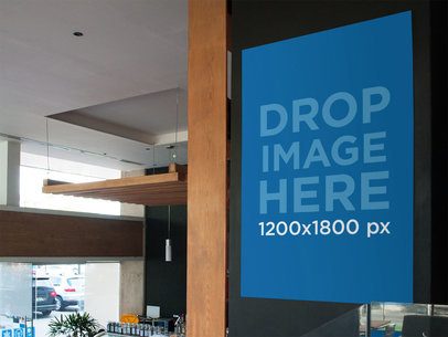 Poster Mockup Taped to a Wall Inside a Coffee Shop 