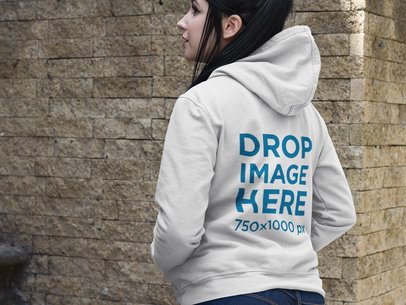 Back Shot of a Woman Wearing a Pullover Hoodie Mockup on a Stone Staircase