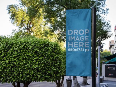Mockup of a Vertical Banner at an Outdoors Environment