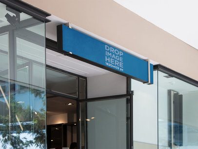 Horizontal Banner Mockup Over a Store Entrance