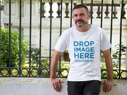T-Shirt Mockup of a Hispanic Middle-Aged Man Outdoors