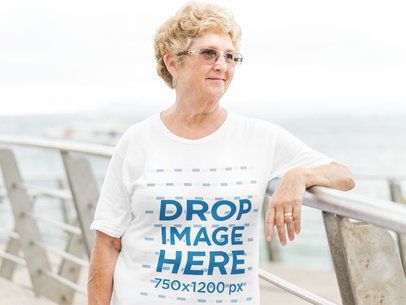 Tee Mockup of an Elderly Woman in an Outdoor Environment