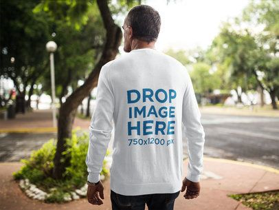 Back of an Elder Man Wearing a Long Sleeve Tee Mockup while Walking Outdoors