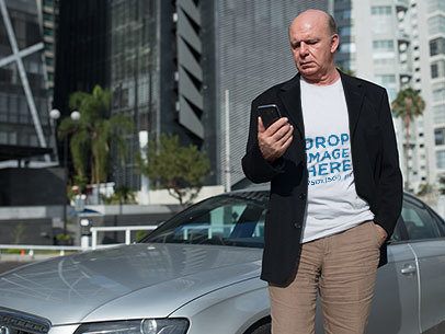 T-Shirt Mockup of an Elder Man in an Executive Outfit