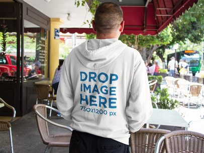 Back of a Man Wearing a Zip Up Hoodie Mockup at a Coffee Shop