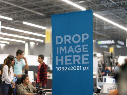 Close-Up of a Vertical Banner Mockup at an Expo a11280